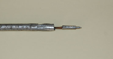 Photo 3 'N' Type connector pin attached to the radiator element with a short length of copper wire soldered to a tinned copper sleeve and them crimped into the aluminium tube.